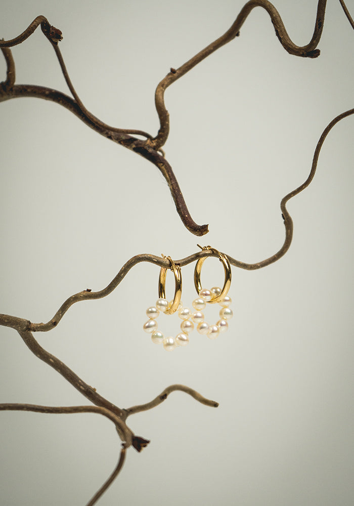 Gold hoop earrings with pearl ring pendants 
